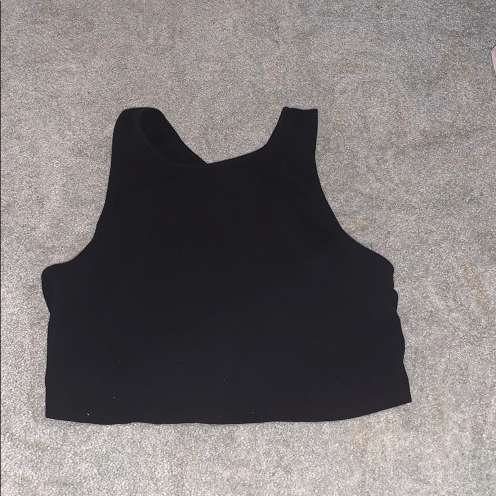 Cropped black tank top.